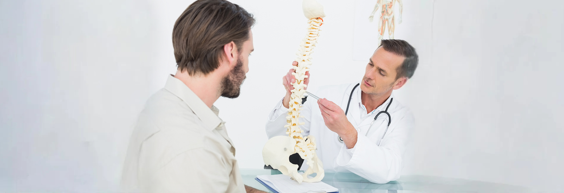 male doctor explaining spine patient 1