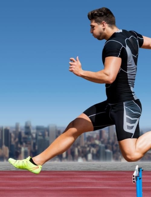 A male athlete wearing black and grey sportswear