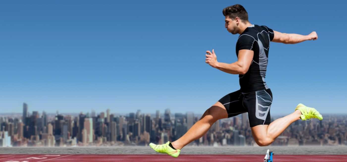 A male athlete running on the track